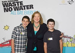 Photo of Councilmember Marti Emerald with two student filmmakers