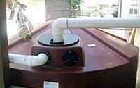 Photo Storage Tank Shown with an Inlet Pipe and Overflow Tube