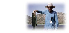 Photo of man holding big fish