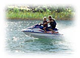 Photo of man and child on jetski