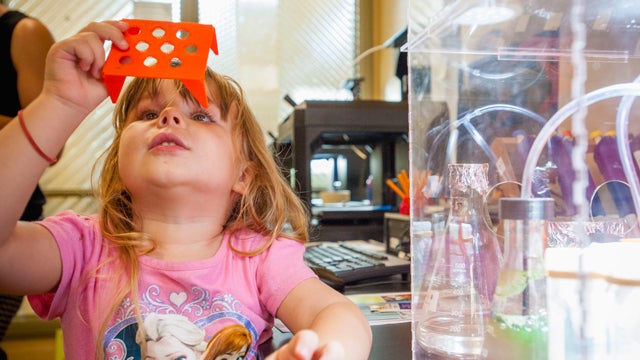 A child participating in a STEAM program at the La Jolla/Riford Library