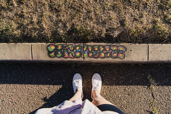 A curb edge decorated with art