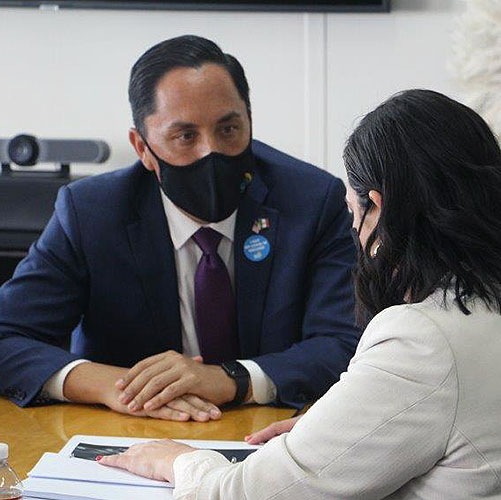 Mayor Todd Gloria in a meeting with a woman