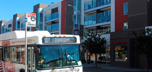 bus in front of apartment building