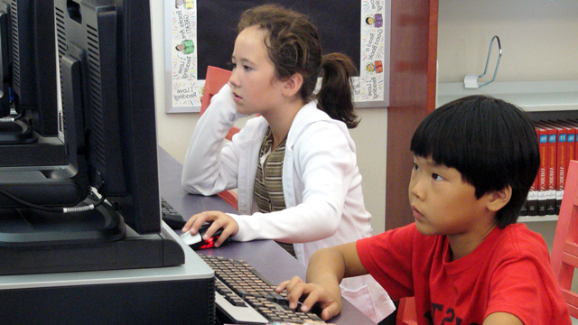 Children using computers at the North University Community Library