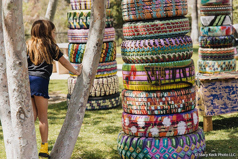 A child visiting the Honeycomb Harmonies art installation