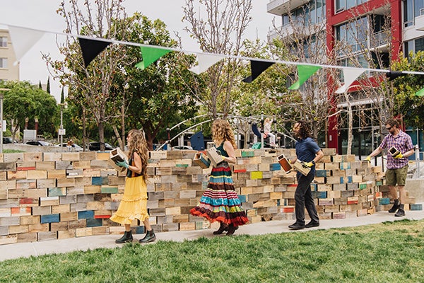 Park visitors participating in the Walking the Wall art performance