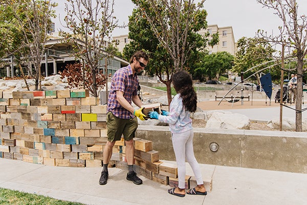 Park visitors participating in the Walking the Wall art performance