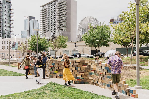 Park visitors participating in the Walking the Wall art performance