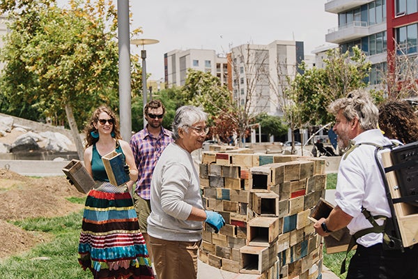 Park visitors participating in the Walking the Wall art performance