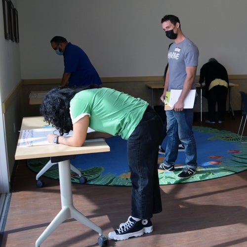 Volunteers working on maps