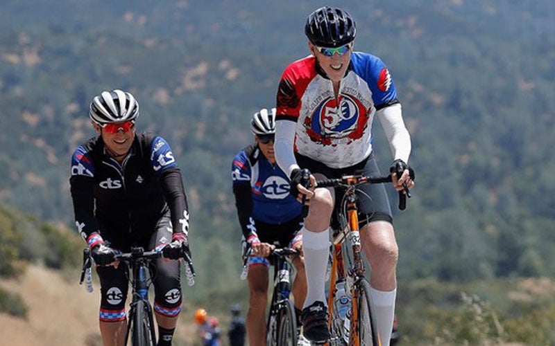 Bill Walton enjoying a bike ride with a couple of friends