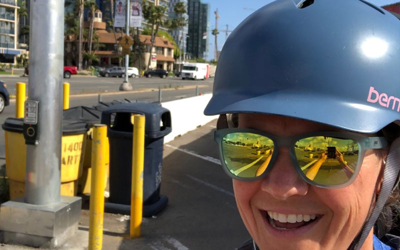 Jade White taking a selfie while wearing a bike helmet