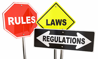 Graphic with street signs reading rules, laws and regulations.