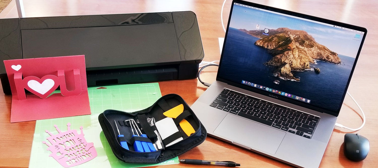 Image of Skyline Hills Library's IDEA Lab with laptop, tools, and vinyl cutter.