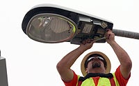 City Worker Installing Electrofits