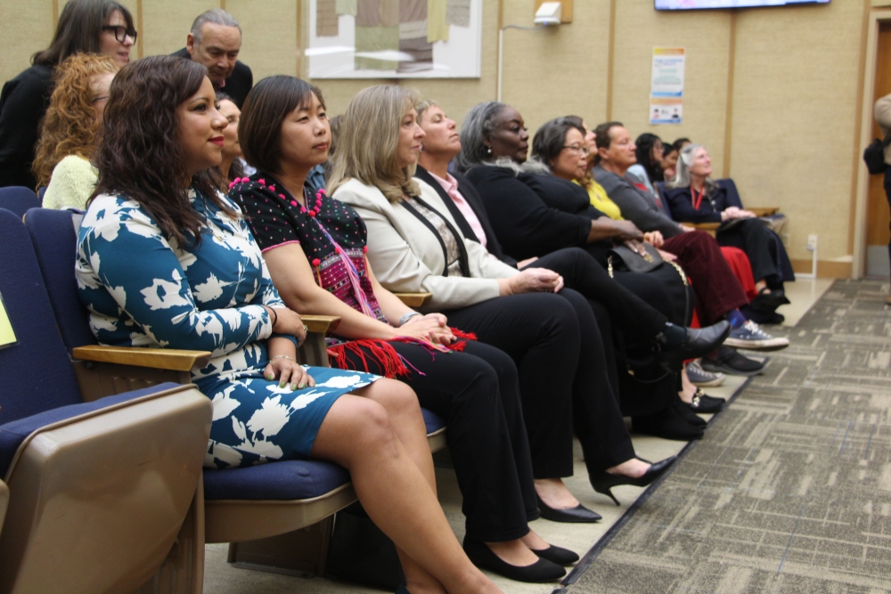 San Diego's 2024 "Women of Distinction" sit in a row during the awards ceremony to honor them 