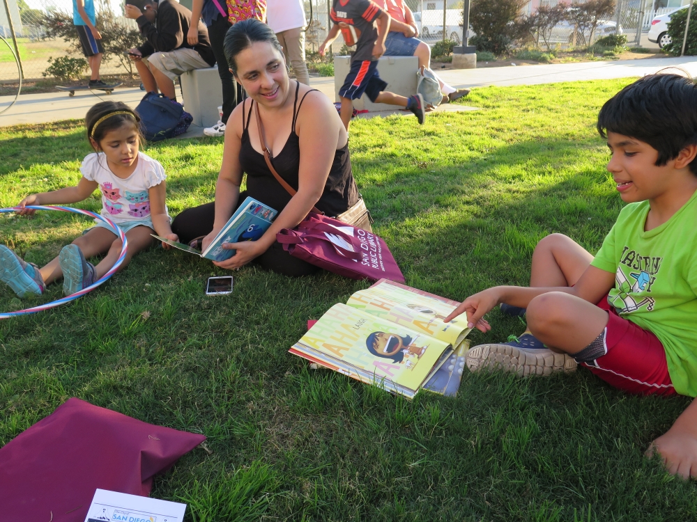 Kids reading outdoors