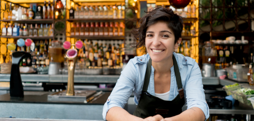 This is a photo of a small business owner smiling at the camera.