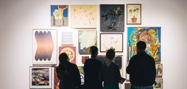 Visitors viewing artworks at the Central Library gallery