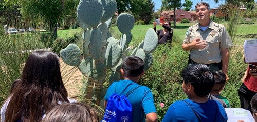 photo of children listening to park ranger