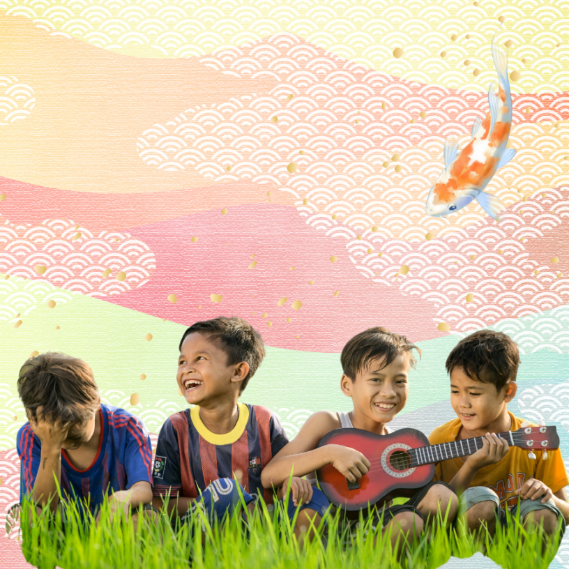Little kids sitting in grass with instrument