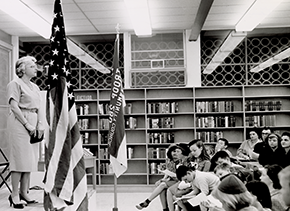 Black and white photo of Miss Breed lecturing