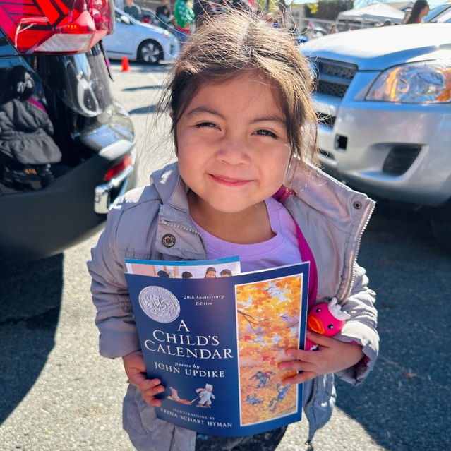 Little girl holding a book