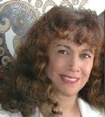 smiling woman with curly brown hair