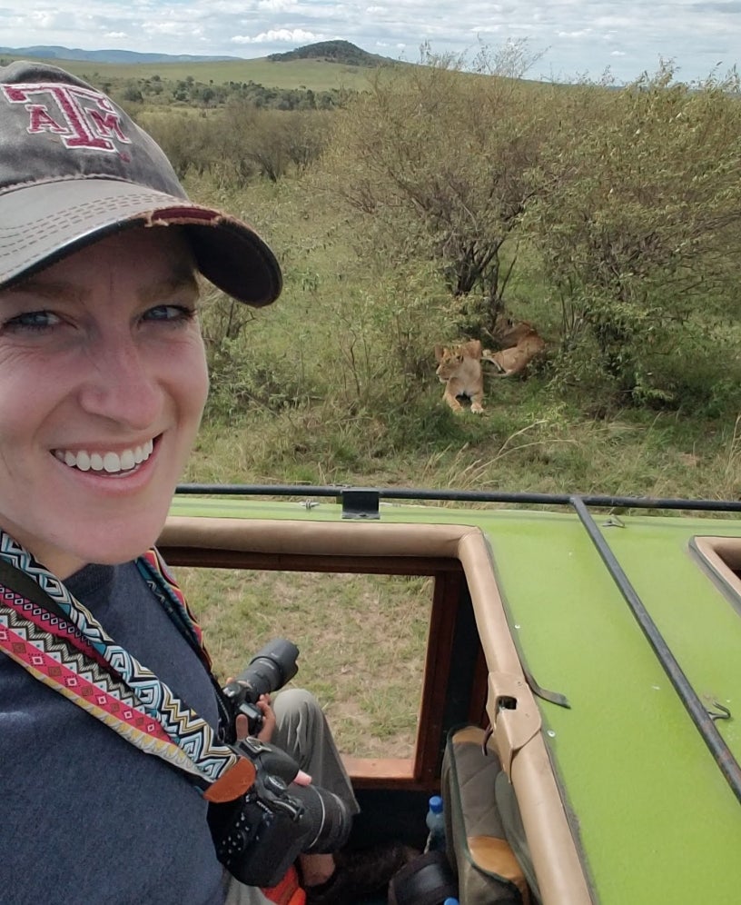 Dr. Curry with lions in background