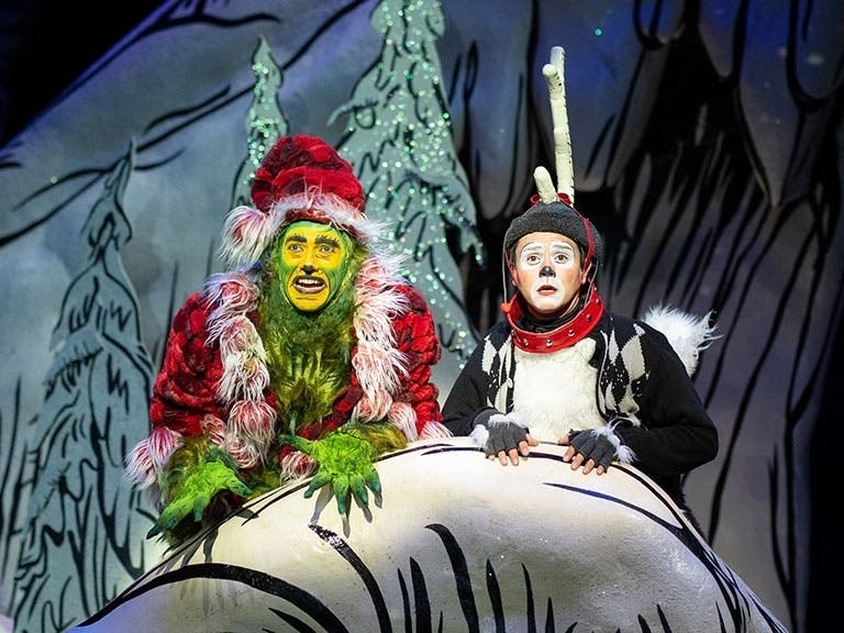 The Grinch (Andrew Polec) and Young Max the Dog (Tommy Martinez) argue over Christmas. (Rich Soublet II for The Old Globe)