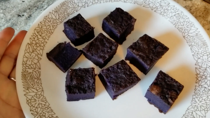 Ube mochi squares on a plate