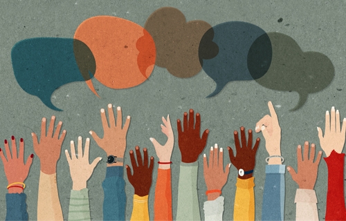 Illustration of speech bubbles on top of raised hands with different colors.
