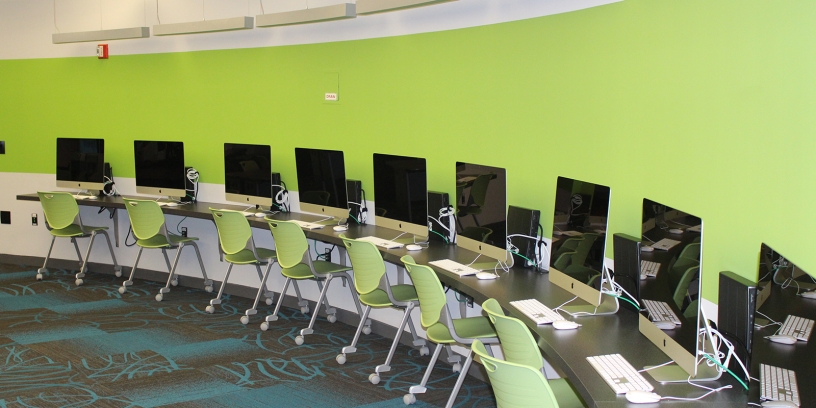 Photo of Apple iMac computers inside the Legler Benbough Teen IDEA Lab at the Valencia Park/Malcolm X Library.