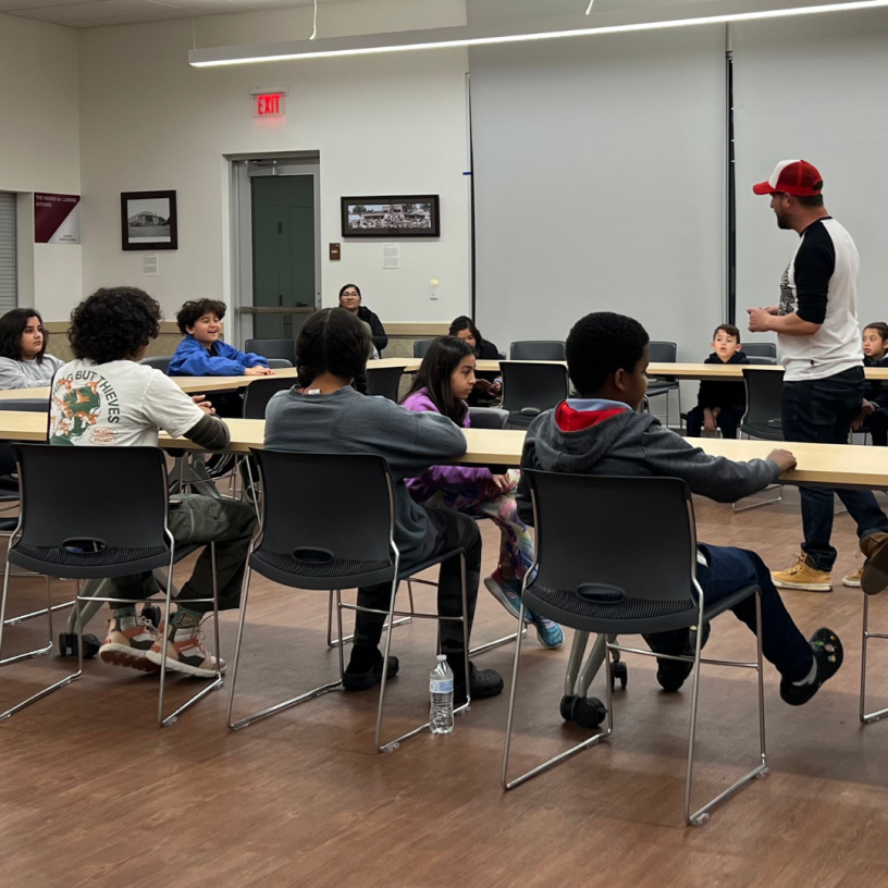 Classroom with kids at tables.