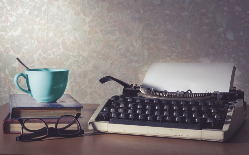 Tea cup and typewriter