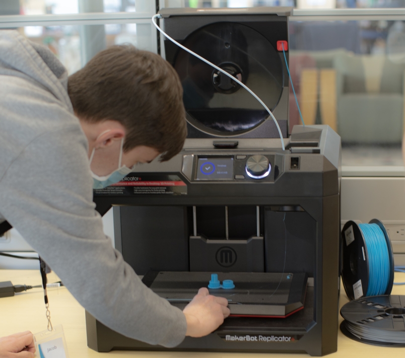 Person calibrating a 3D printer