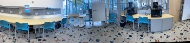Tables, chairs, desks and equipment inside makerspace