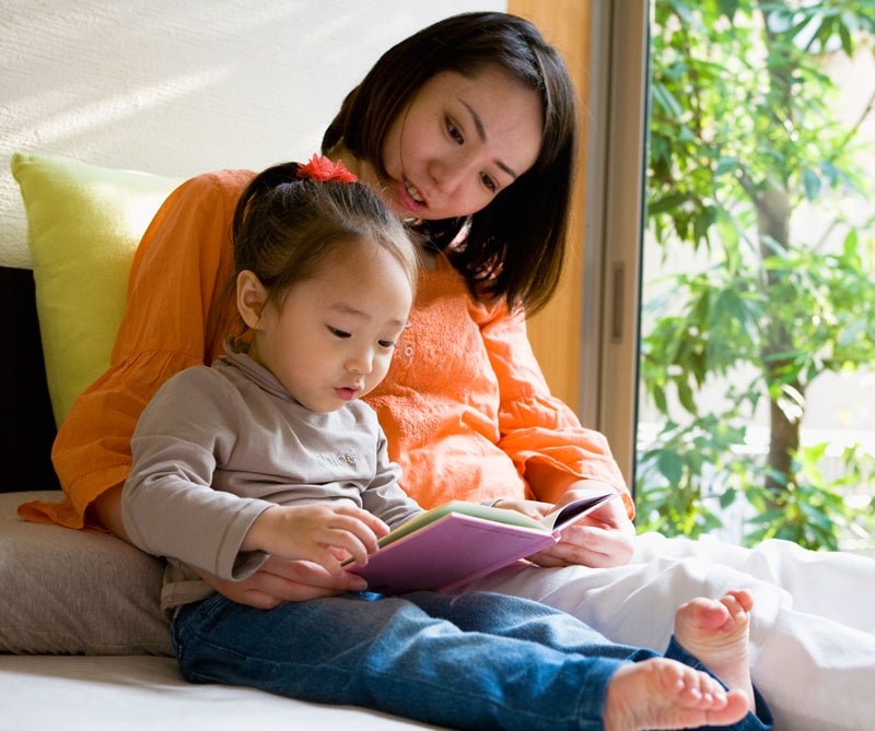 Mom reading with baby.