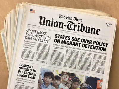 Image of a stack of the San Diego Union-Tribune newspaper