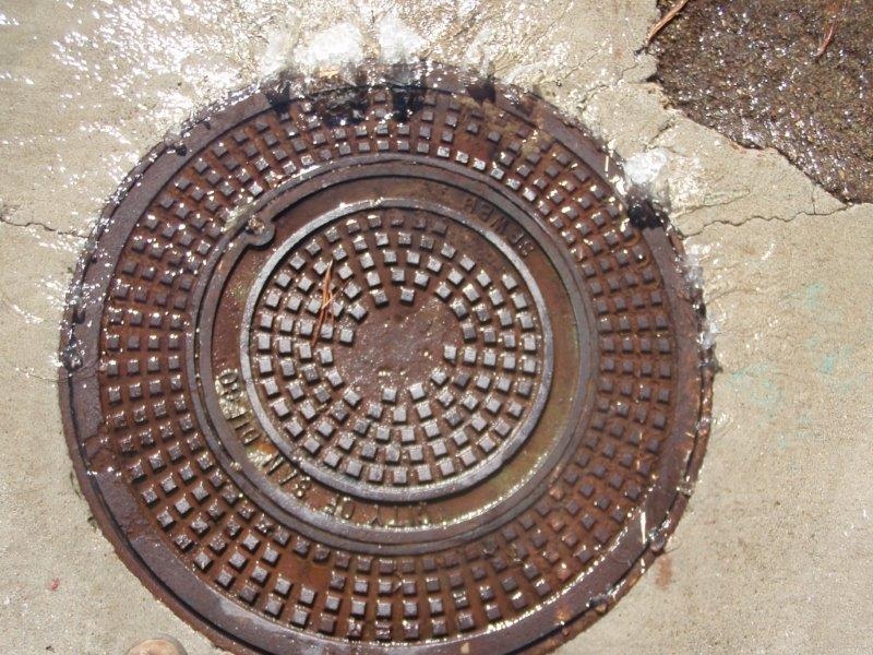 Wastewater spilling out from a manhole