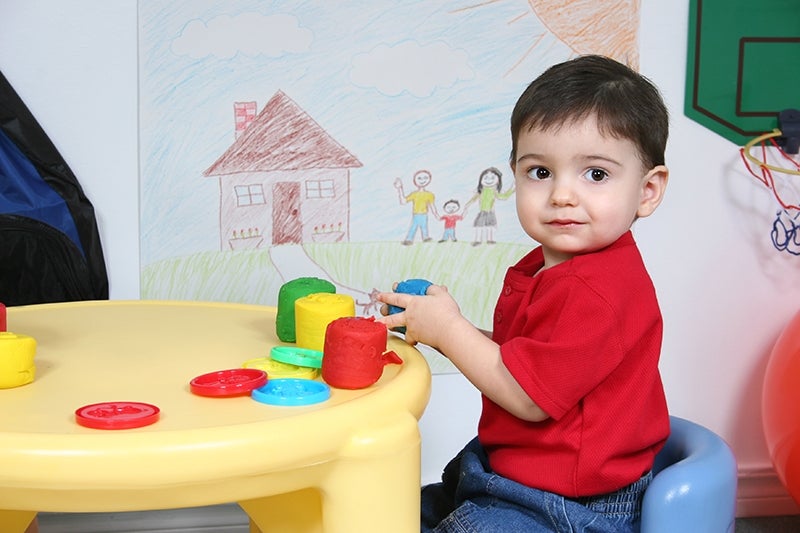 toddler playing with toys