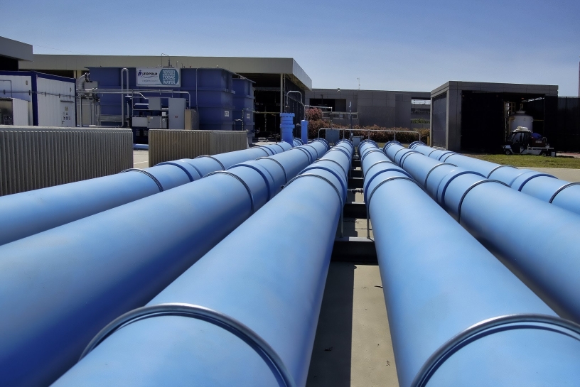 six large blue pipes connected to the City's Pure Water Demonstration Facility