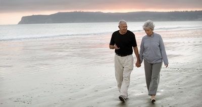 Seniors Walking on Beach