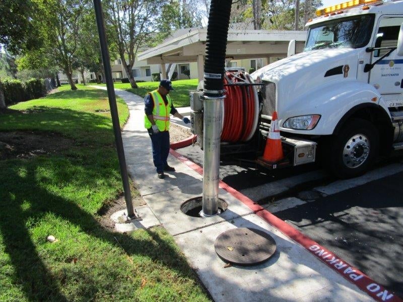 City vactor truck at manhole