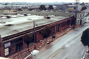 Earthquake damaged unreinforced masonry buildings causing parapets to collapse onto the sidewalk.