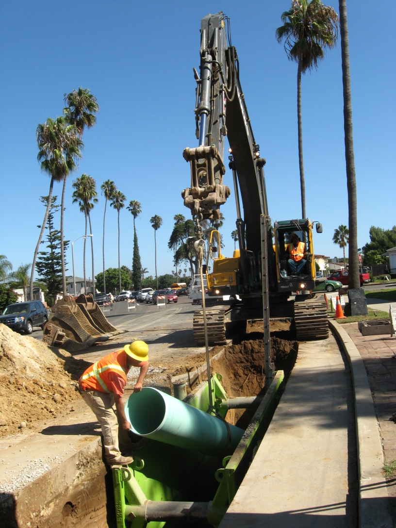 construction crew installing new sewer main pipeline