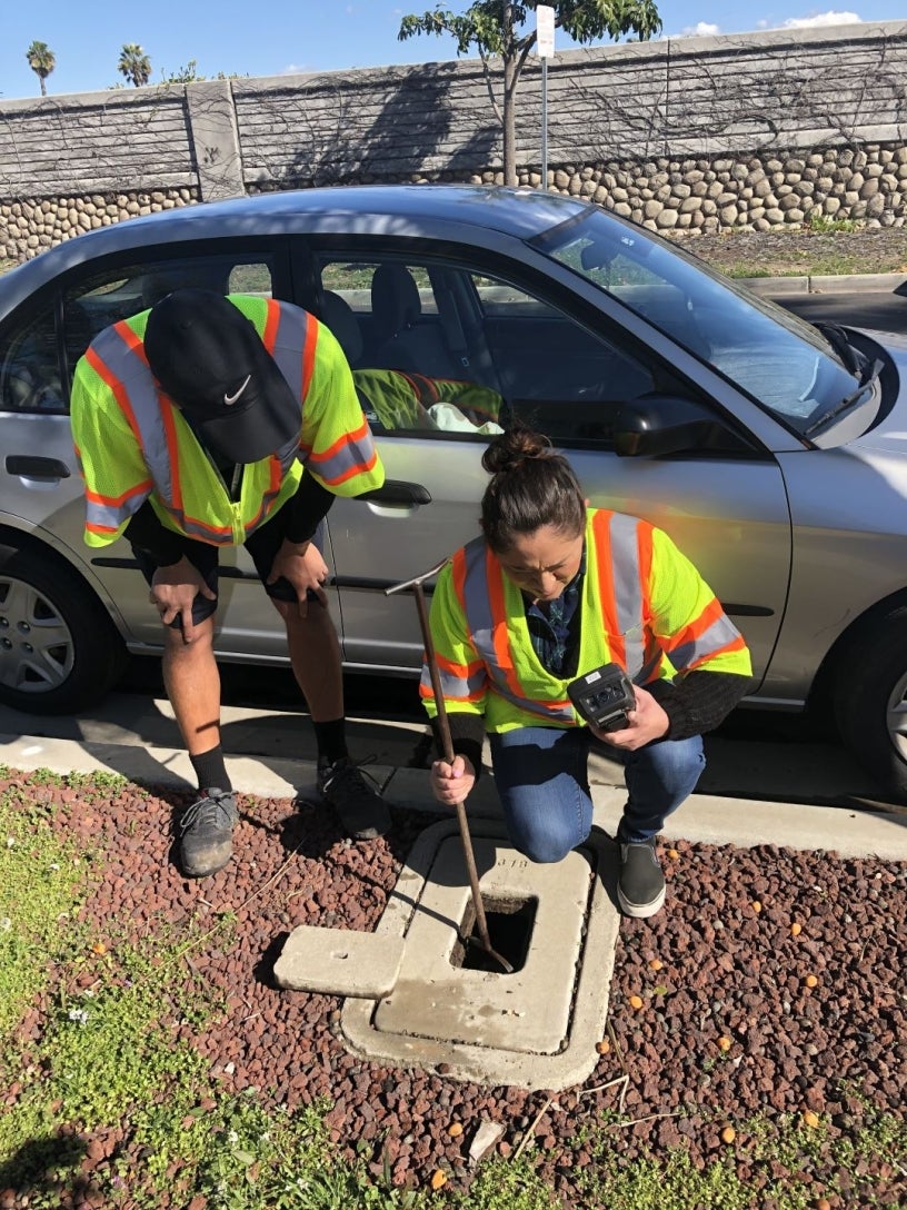 City crew checking water meter