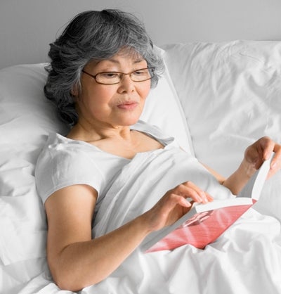 Woman reading book.