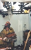 firefighter in burned building